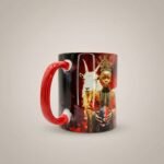 Taza de Eleguá niño con su corona y un chivo, asa e interior rojo