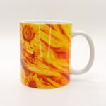 Taza de Oshún con girasoles dorados y su nombre en el asa